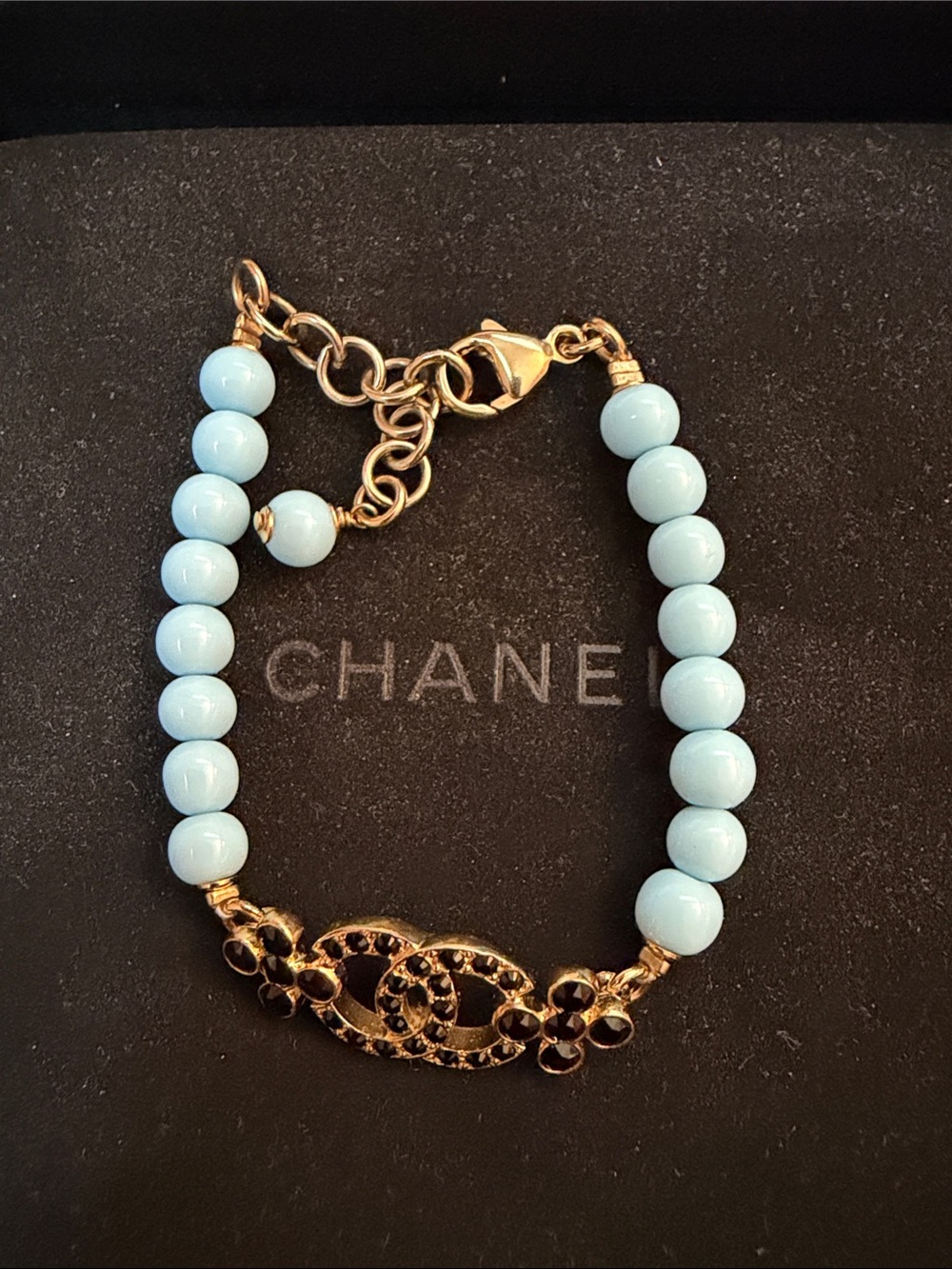 CHANEL Gold-Tone Bracelet with Light Blue Beads and Logo Charm - Picture 2 of 5